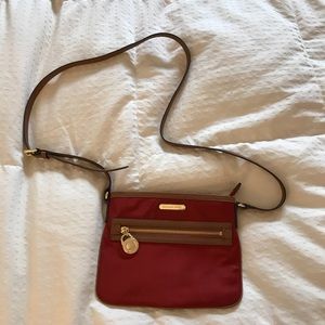 Michael Kors crossbody purse. Red with brown trim.